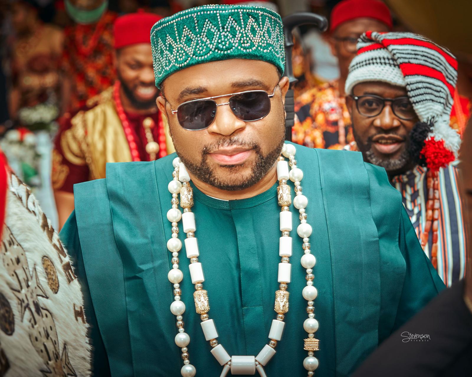 Close-up of Igwe Dr. Amanze N. Ikwu in green attire and beads